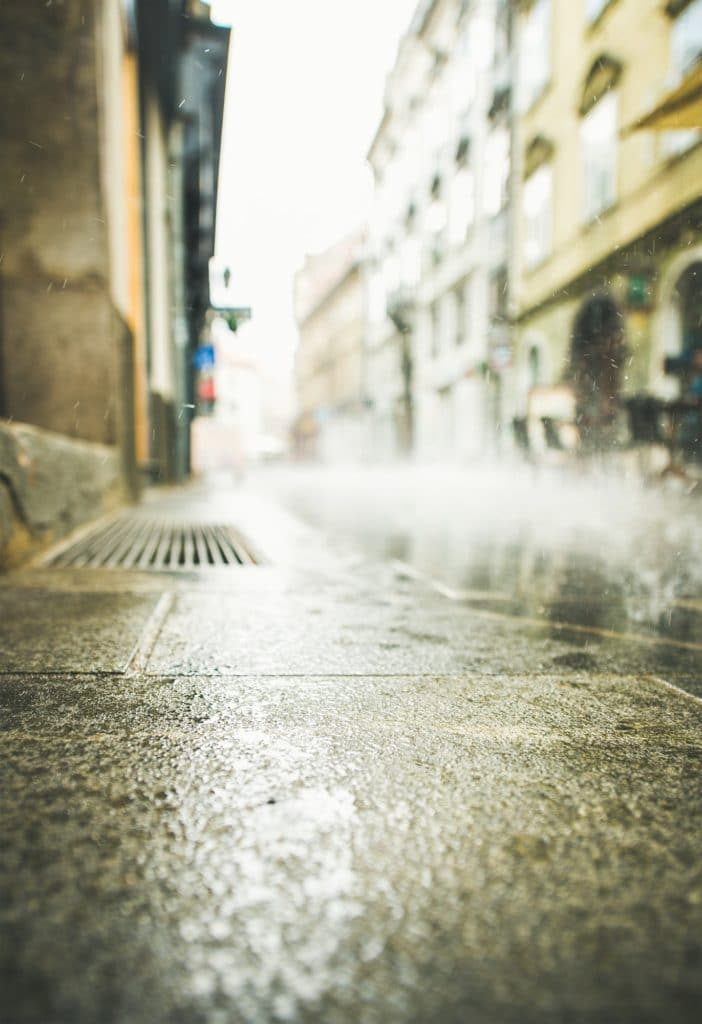 Rainfall flowing into a drain