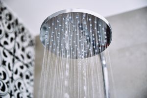 shower head with flowing water in bathroom 2026 03 24 00 32 07 utc