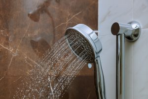 shower head sprays water in bathroom interior 2026 03 09 02 58 49 utc