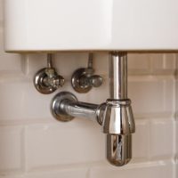 Basin siphon or sink drain in a bathroom, clean